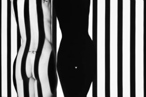 Stunning nude torso light painted with black and white stripes