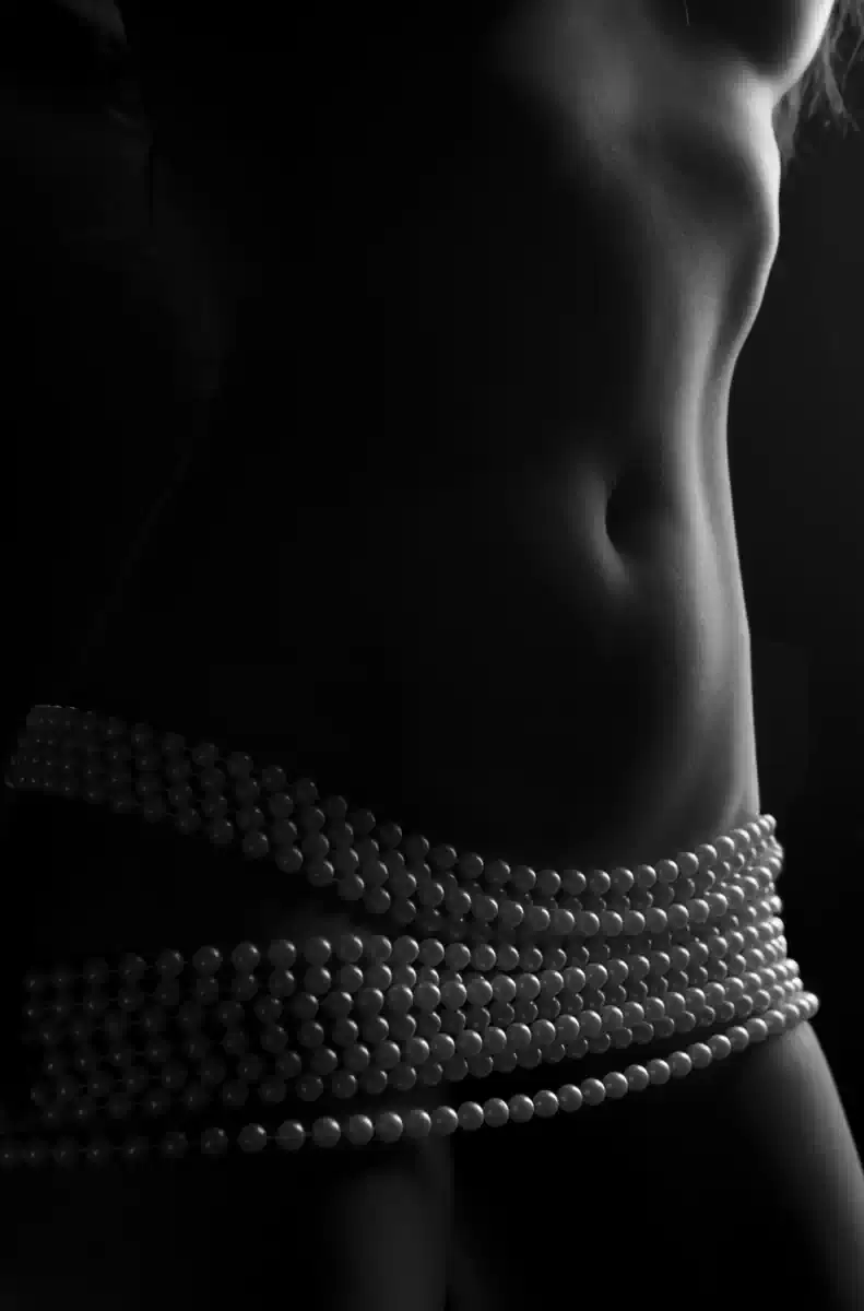 Low Key Nude Torso wrapped in rows of pearls